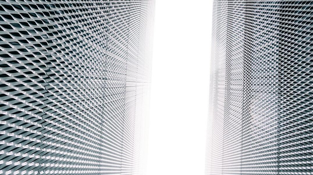 Server room with rows of illuminated data racks