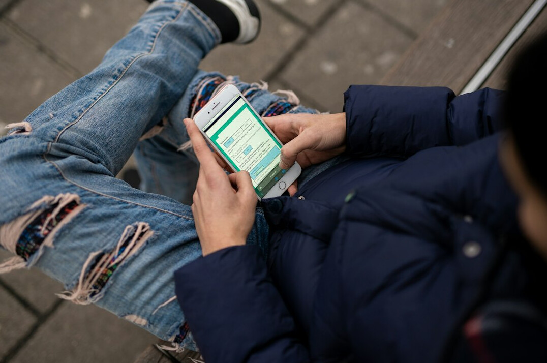 person checking insurance app on smartphone